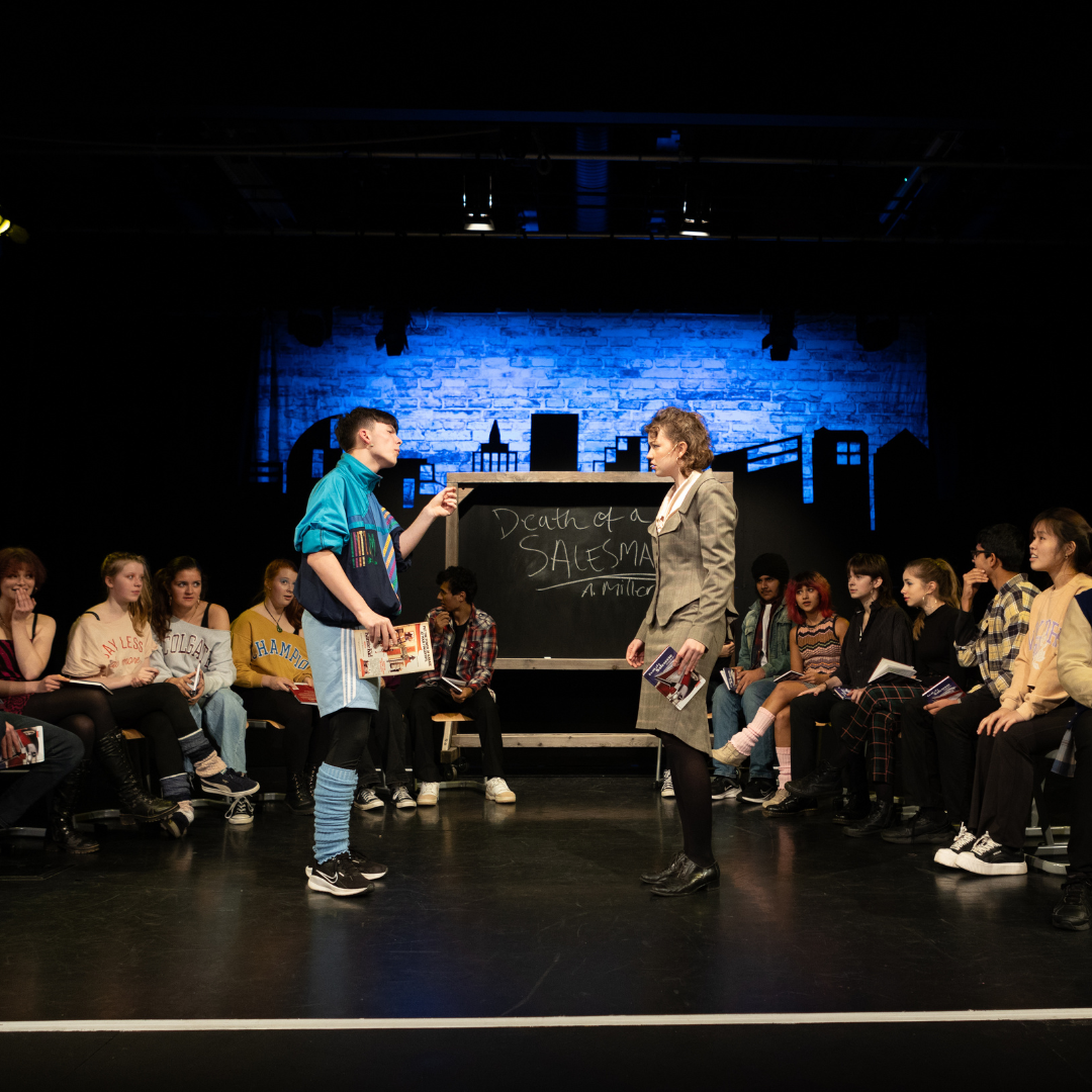 A level students performing on stage