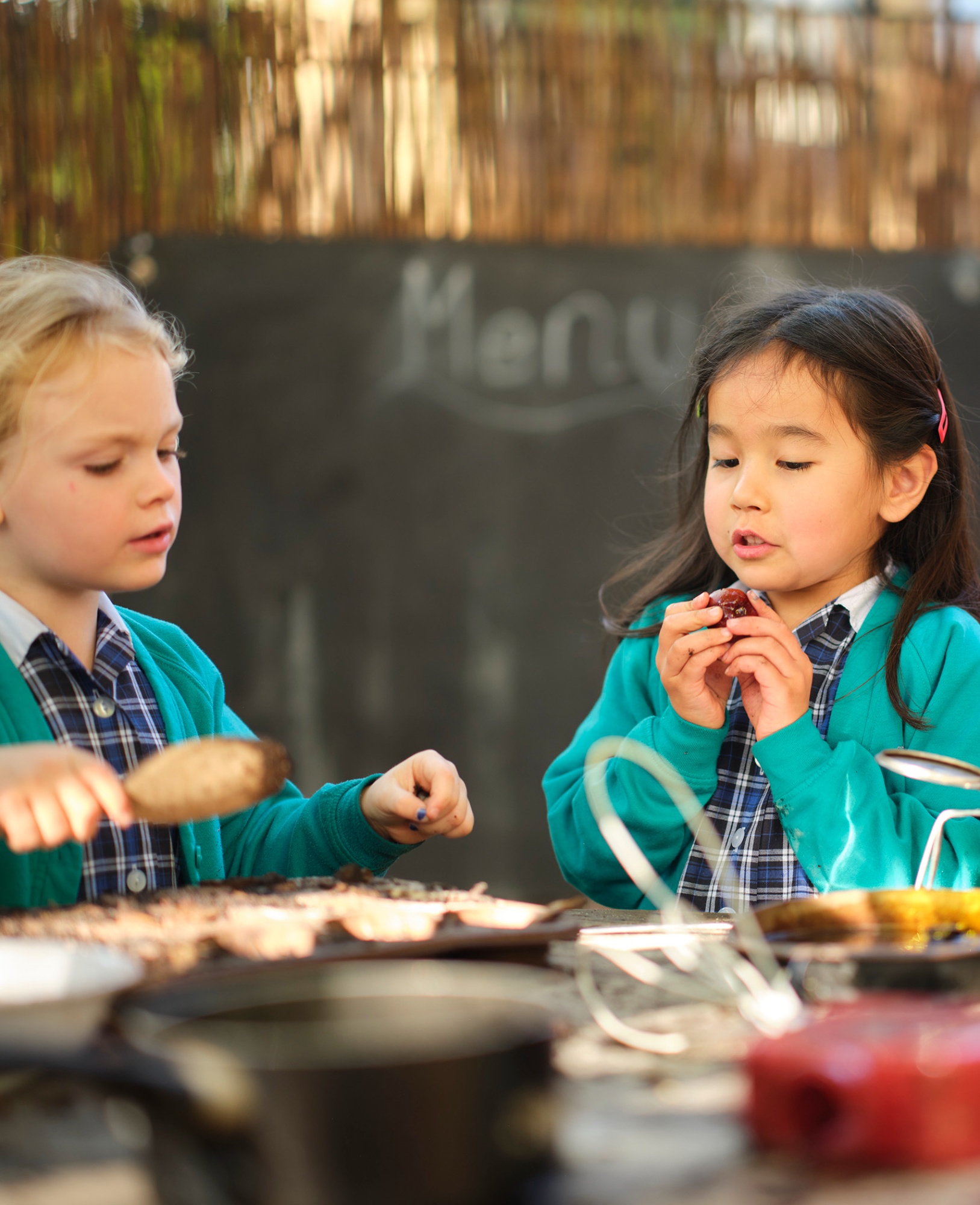 Children eating lunch when clicked it opens the Nursery and Early Years - Cambridge Menu 