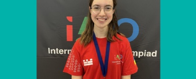 Stephen Perse Cambridge student Kseniia S smiles and proudly displays her gold AI Olympiad medal