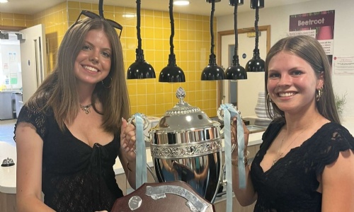 House Captains for Street hold the House trophy